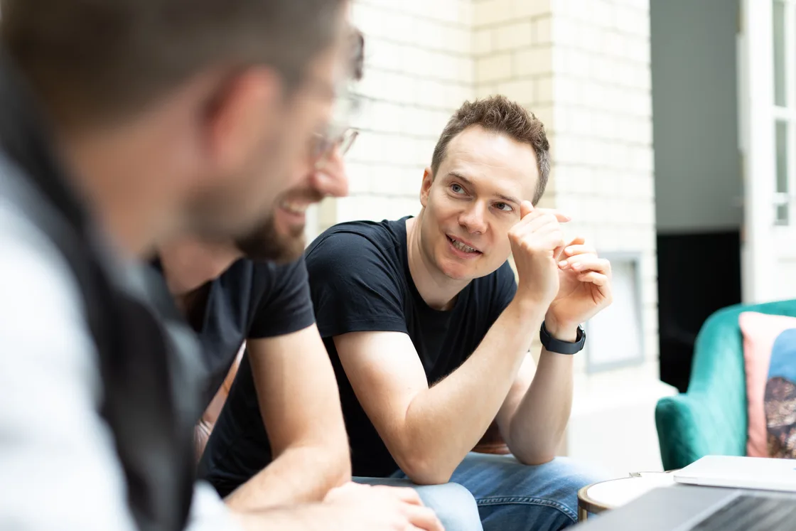 Tim in conversation with colleagues